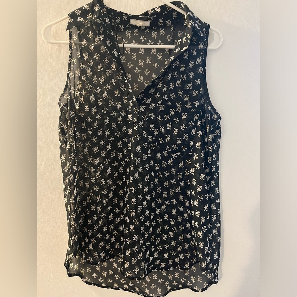 Sheer black top with cream colored bow pattern